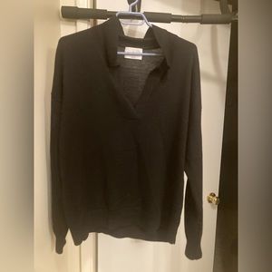 Black. 100% merino wool sweater.